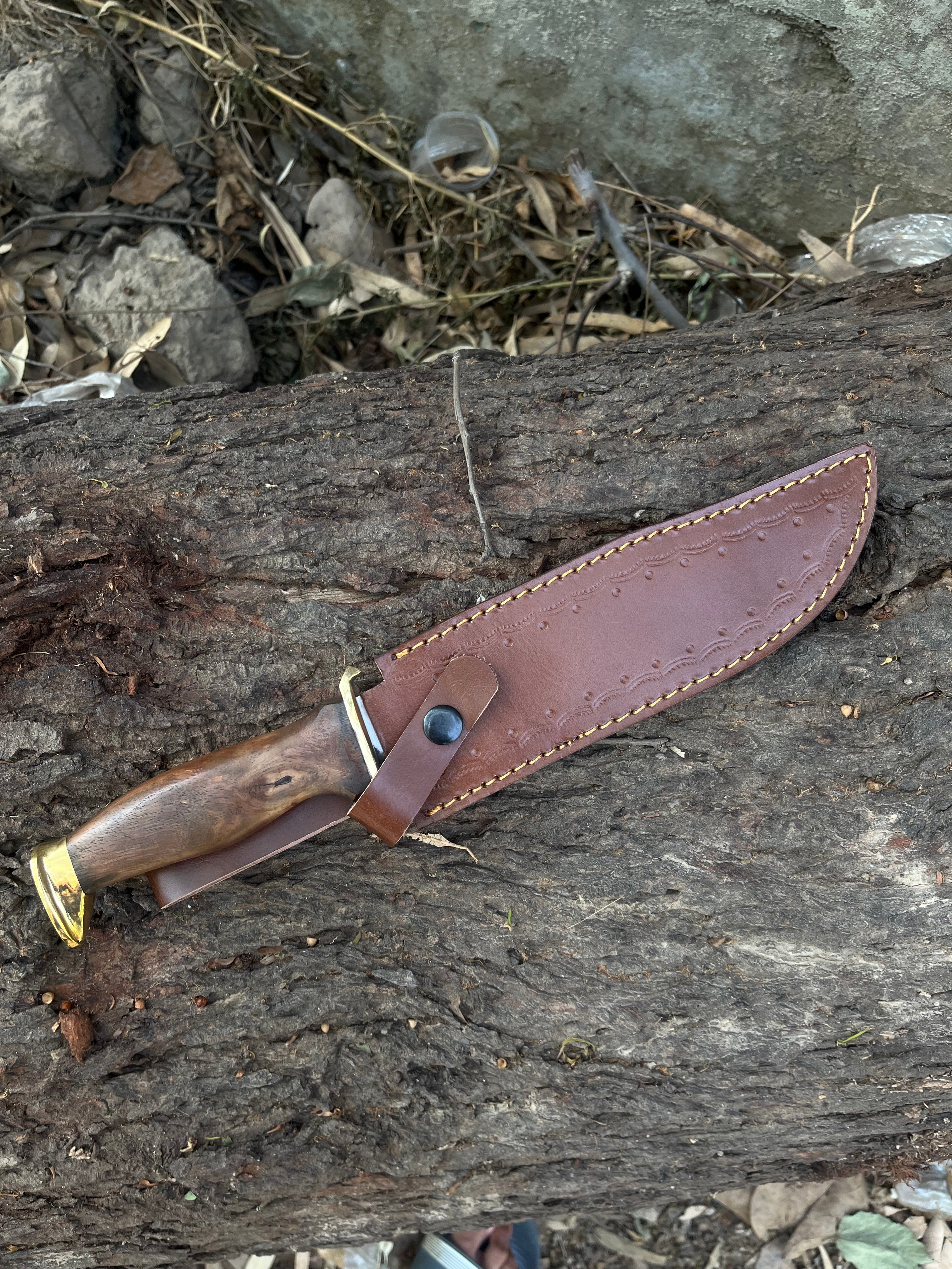 Handmade hunting knife with leather cover